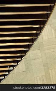 Architectural detail of reflective steel and stone.