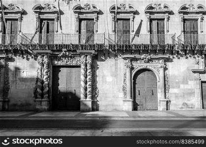 Architectural detail of the city hall building in Alicante, Spain; black and white image