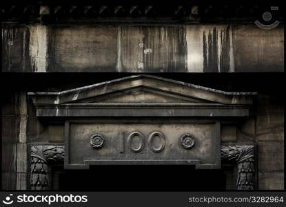 Architectural detail with the number 100.