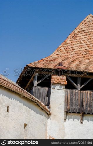Architectural details of medieval church. View of fortified church of Viscri, UNESCO heritage site in Transylvania. Romania, 2021.. Architectural details of medieval church. View of fortified church of Viscri, UNESCO heritage site in Transylvania. Romania, 2021.