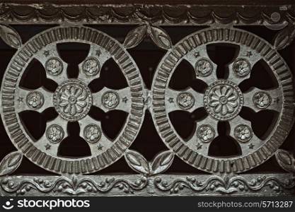 Architectural metal flower ornament close-up
