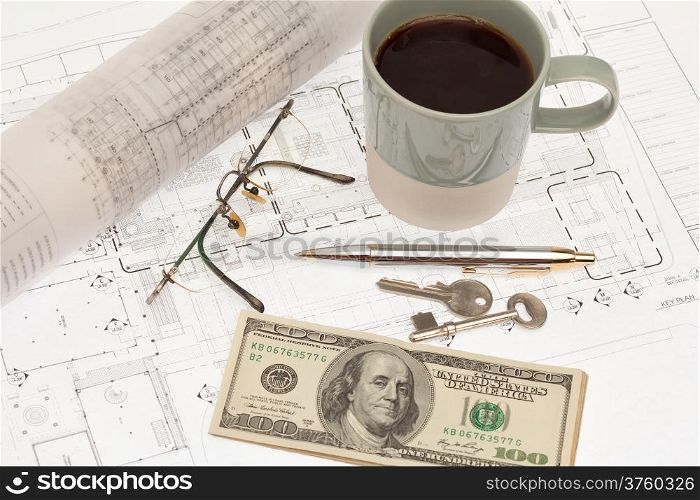 Architectural project with coffee and cash