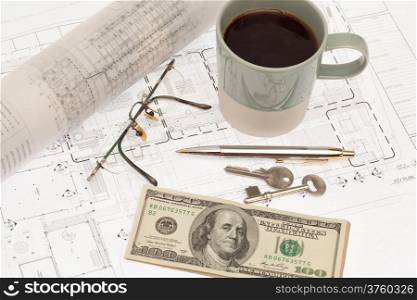 Architectural project with coffee and cash