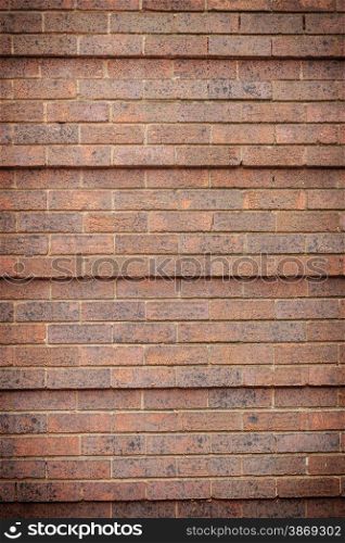 Architecture. Closeup of brown red brick wall as texture or background. Architectural detail.