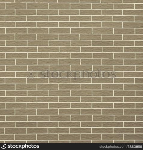 Architecture. Closeup of brownish green brick wall as background texture or pattern. Square format.