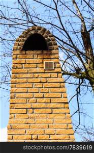 Architecture. Closeup of red brick chimney with ventilation exterior. Architectural detail.