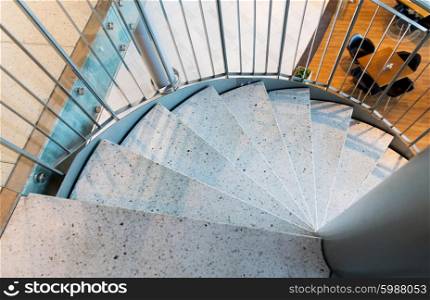 architecture, design and interior concept - close up of stone spiral staircase at restaurant