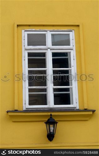 architecture details of prague, white window on yellow wall