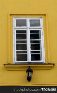 architecture details of prague, white window on yellow wall