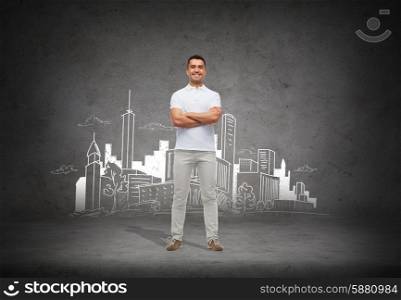 architecture, development and people concept - smiling man in white t-shirt with crossed arms over city sketch and concrete background