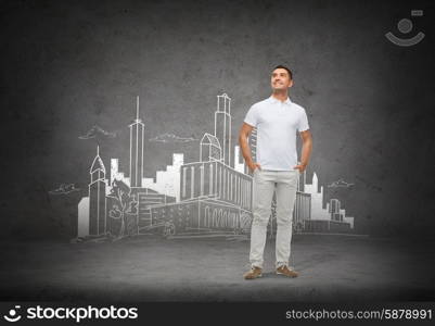 architecture, development, happiness and people concept - smiling man with hands in pockets looking up over city sketch and concrete background