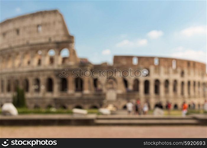 architecture, history and tourism concept - Colosseum in Rome blurred background