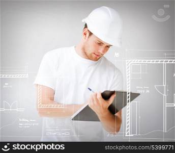 architecture, interior design and renovation concept - male architect in helmet looking at blueprint
