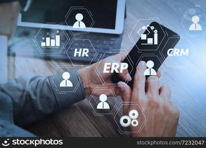 Architecture of ERP (Enterprise Resource Planning) system with connections between business intelligence (BI), production, CRM modules and HR diagram.Hand using mobile payments online shopping.