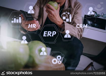 Architecture of ERP (Enterprise Resource Planning) system with connections between business intelligence (BI), production, CRM modules and HR diagram.hipster hand using smart phone for mobile payments online.