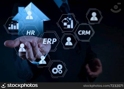Architecture of ERP (Enterprise Resource Planning) system with connections between business intelligence (BI), production, CRM modules and HR diagram.businessman hand holding 3d house as insurance concept.