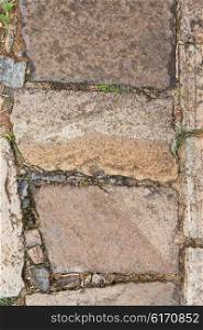 architecture, stonework and masonry concept - close up of paving stone outdoors