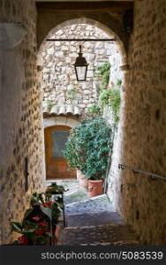 Archway of the downtown street in the old village Vence , France.