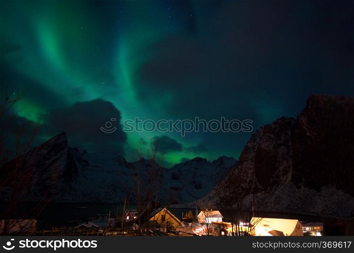 arctic landscape and northern lights. aurora borealis on lofoten islands, hamnoy. Norway