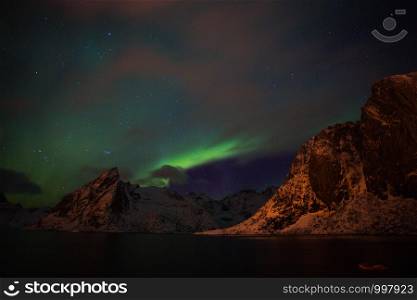 arctic landscape and northern lights. aurora borealis on lofoten islands, hamnoy. Norway