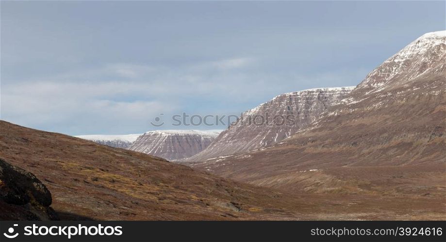 Arctic landscape in Greenland. Arctic landscape in Greenland around Disko Island with mountains in summer
