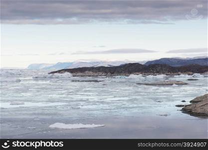 Arctic landscape in Greenland. Arctic landscape in Greenland around Ilulissat with icebergs and mountains