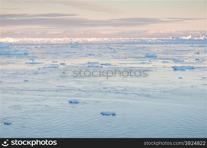 Arctic landscape in Greenland. Arctic landscape in Greenland around Ilulissat with mountains and icebergs