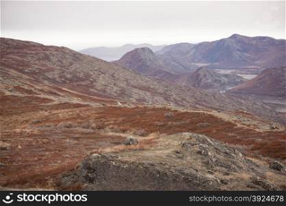 Arctic landscape in Greenland. Arctic landscape in Greenland with mountains and brown vegetation in autumn