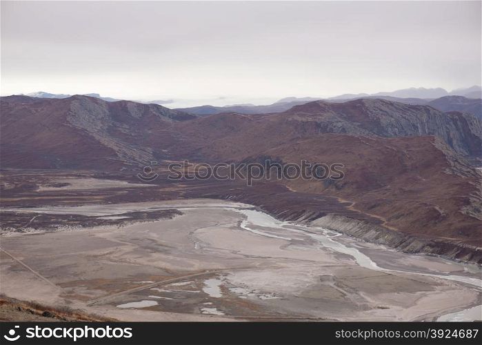 Arctic landscape in Greenland. Arctic landscape in Greenland with mountains and brown vegetation in autumn