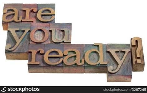 Are you ready question - vintage wooden letterpress printing blocks, stained by color inks, isolated on white