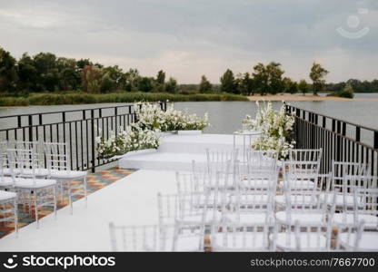 area for the wedding ceremony, on a stone pier near the water