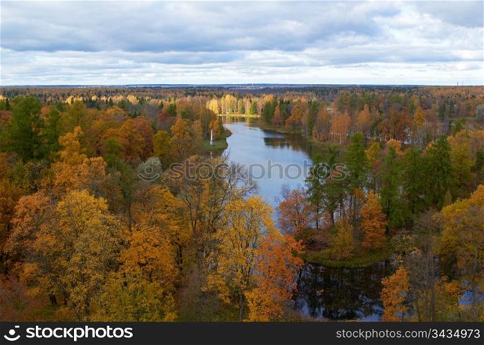 Areal view of lake and golden autumn trees in Gatchina park. St. Petersburg