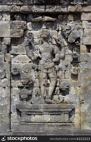 Arfuna on the wall of temple in Plateau Dieng, Java
