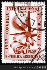ARGENTINA - CIRCA 1957: a stamp printed in the Argentina shows Globe, Flag and Compass Rose, International Congress for Tourism, circa 1957