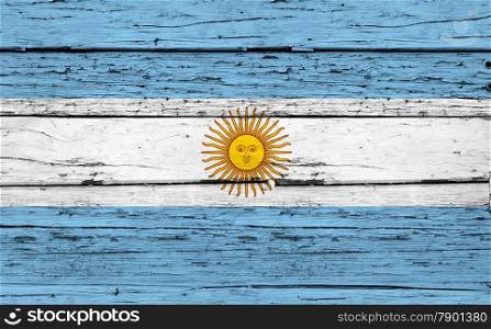Argentina grunge wood background with Argentinian flag painted on aged wooden wall.