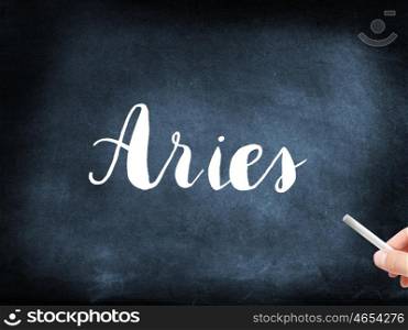 Aries written on a blackboard