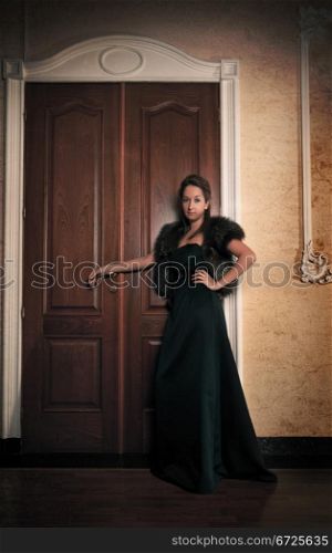 aristocratic lady in hall of old house
