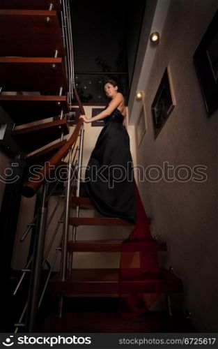 aristocratic lady on stairs in luxury house