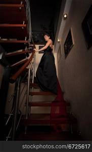 aristocratic lady on stairs in luxury house