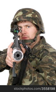 Armed soldier aiming m16 in studio. Isolated