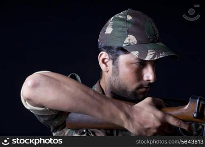 Army man aiming with a rifle