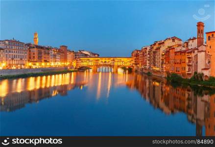 Arno and Ponte Vecchio at night, Florence, Italy. Panorama of River Arno and famous bridge Ponte Vecchio at night from Ponte Santa Trinita in Florence, Tuscany, Italy