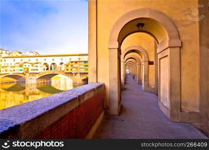 Arno river coastline and Ponte Vecchio bridge in Florence view, Tuscany region of Italy