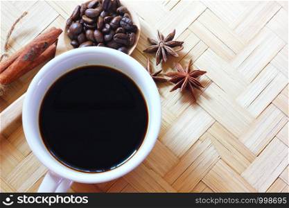 aroma drip black coffee with cinnamon,anise on bamboo floor