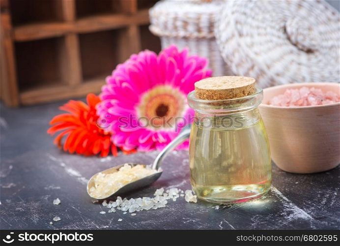 aroma oil in glass bottle and on a table