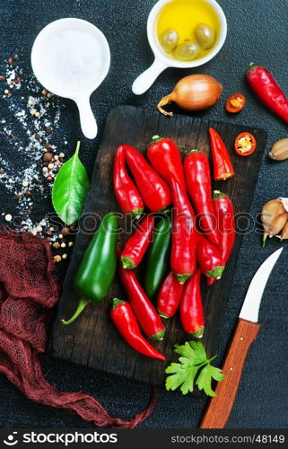 aroma spice on a table, chilli peppers and aroma oil