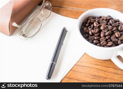Aroma working table with roasted coffee, stock photo