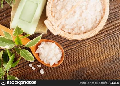 Aromatic bath salt in a wooden spoon and soap