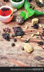 Aromatic herbal tea. various types of fragrant herbal tea on vintage wooden background