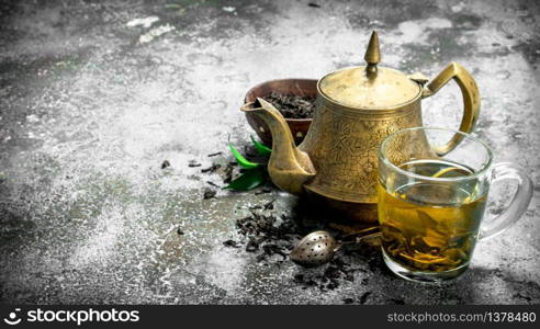 Aromatic Indian tea. On a rustic background.. Aromatic Indian tea.